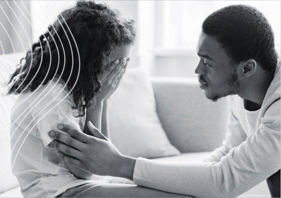 father comforting crying girl